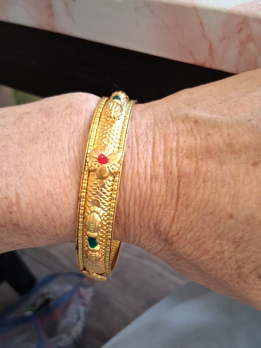 Gold-Tone Floral Bangle Bracelet with Red and Green Accents